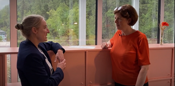 Henrietta Carbonel and Monica Ward conversing